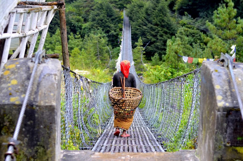 woman-ropeway-bridge-nepal